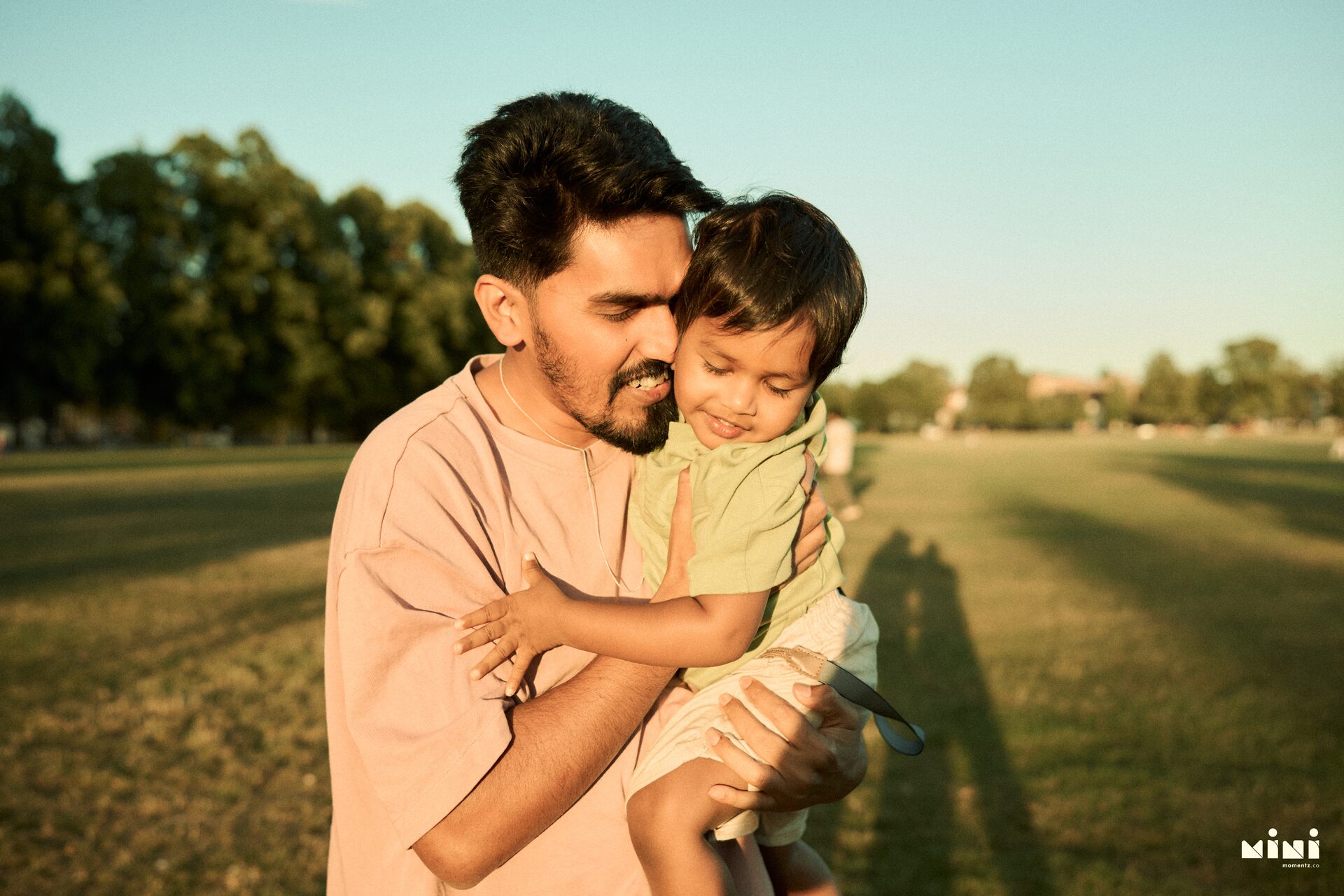 Father and toddler sharing a quiet forehead-to-forehead moment