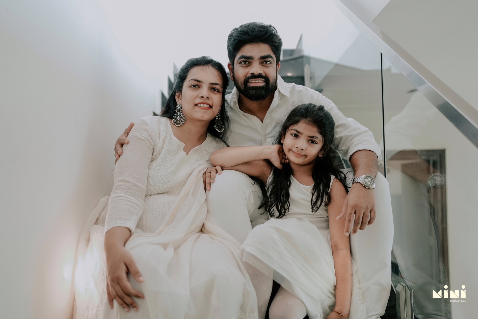 South Indian family portrait on staircase — home family photography UK Mini Momentz