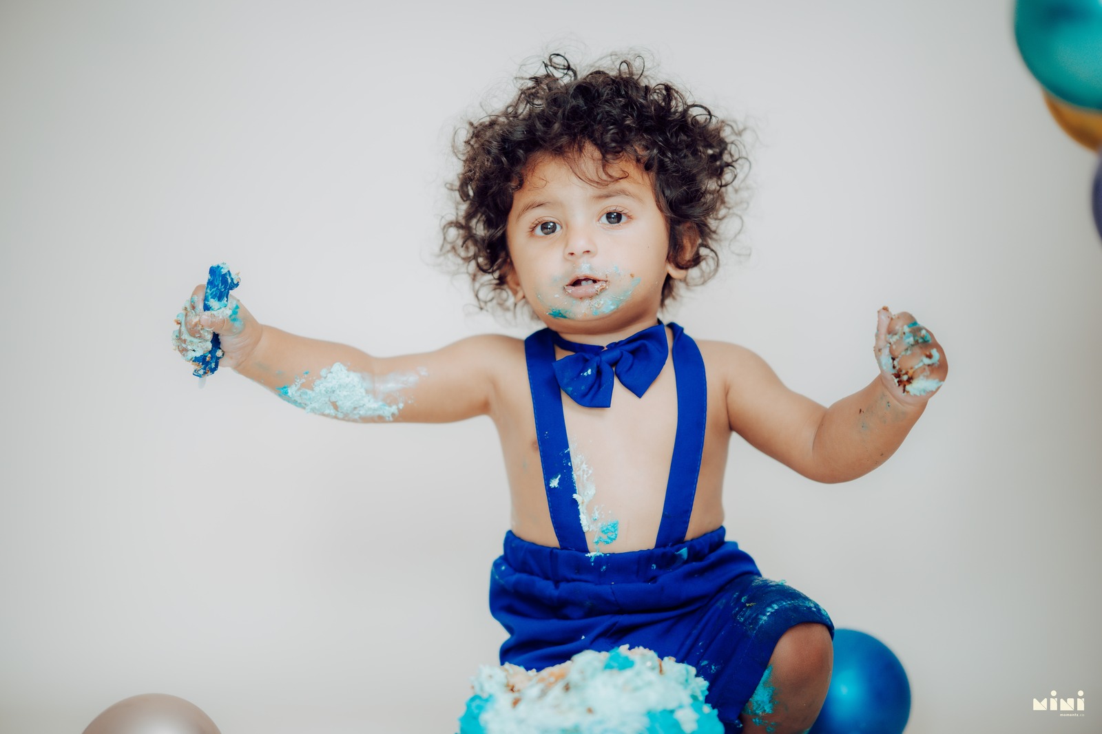 Toddler enjoying a relaxed cake smash session