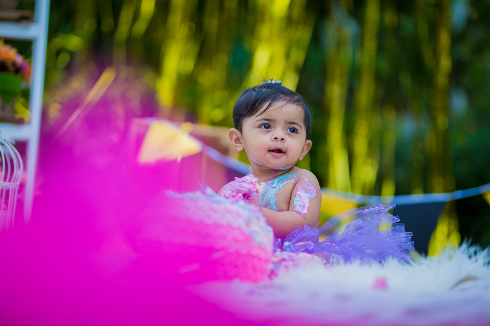 Little girl during an outdoor first birthday portrait session