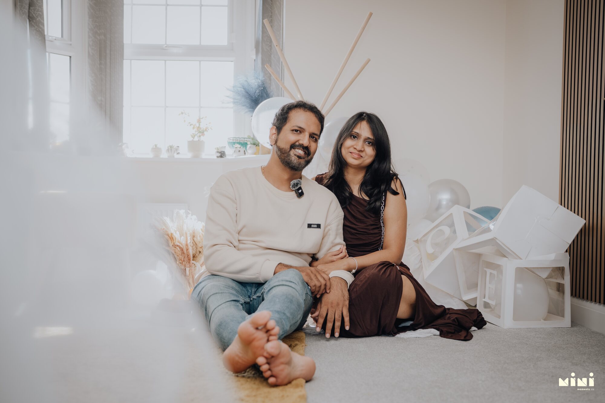 Ramesh and Seema sitting together indoors in Barkby Thorpe, Leicester, before Sid's arrival in the story — Mini Momentz