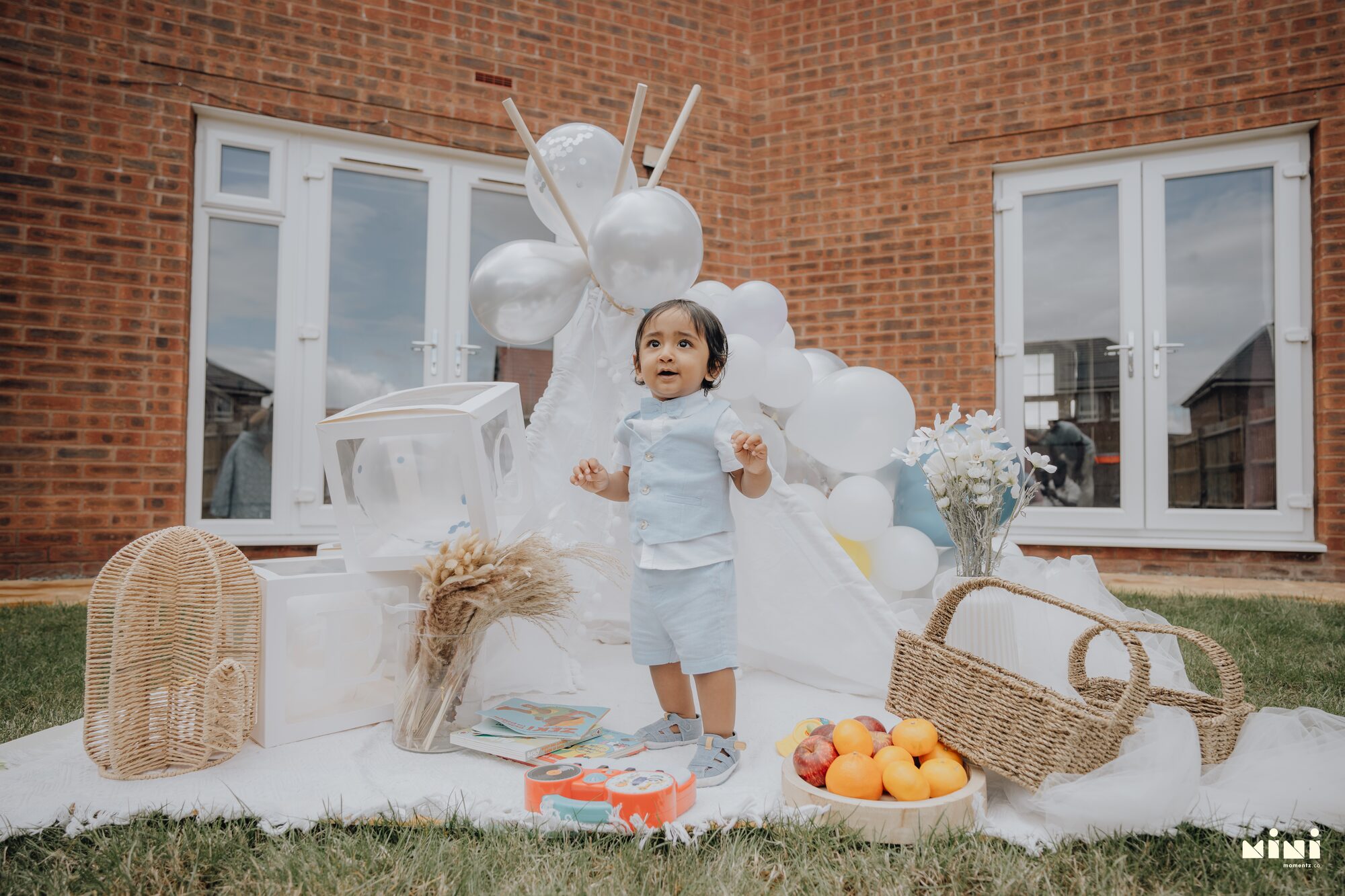Sid standing alone outdoors in Barkby Thorpe, Leicester, at one year old — Mini Momentz family photographer